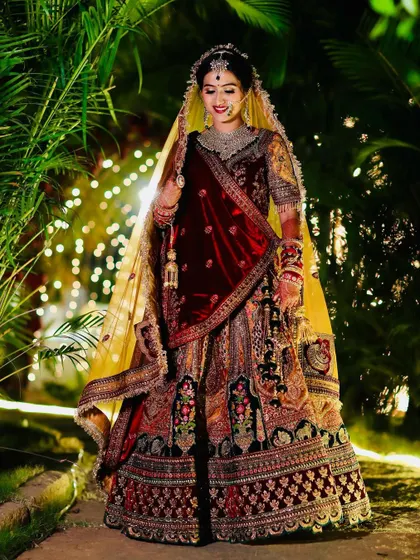 A full-length shot in a beautiful outdoor setting, showing how the bridal look is stunning both up close and from a distance.