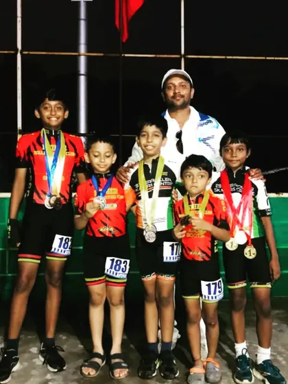 Here are some of our proud medal winners from the Open district competition. It's always a joy to see them with their coach, celebrating their achievements as a team.