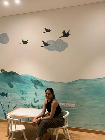 The finished mural for a child's room, featuring a friendly bear in the ocean. The goal was to create a calm and imaginative world for them to grow up in.