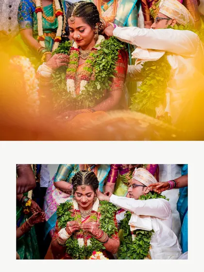 The groom placing the garland on the bride, a key moment in the wedding ceremony. The creative framing through a flare of light adds an artistic touch to the shot.