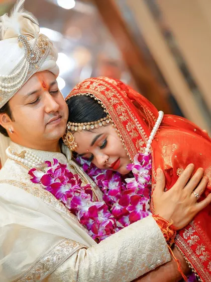 A tender and emotional hug between the bride and groom. This photo beautifully captures the deep connection and love they share on their wedding day.