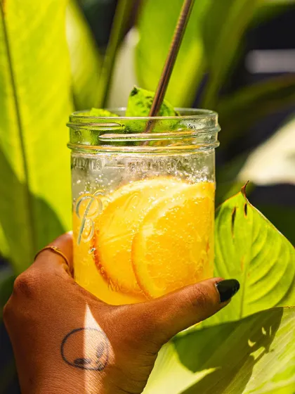 Our orange and mint soda, a bright and zesty drink perfect for a sunny day.