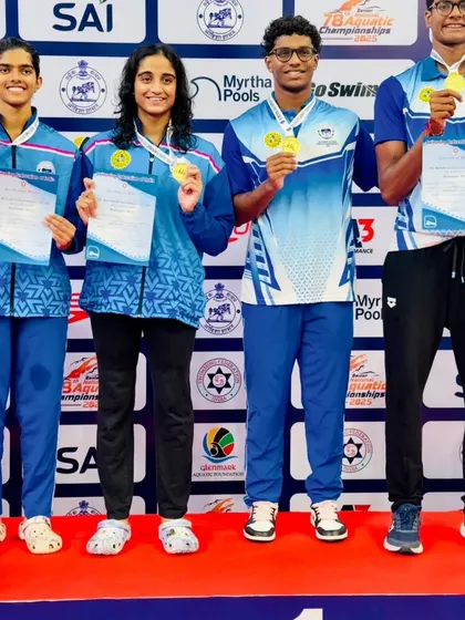 The gold-winning 4x100m Freestyle Mixed Relay team setting a new national record.