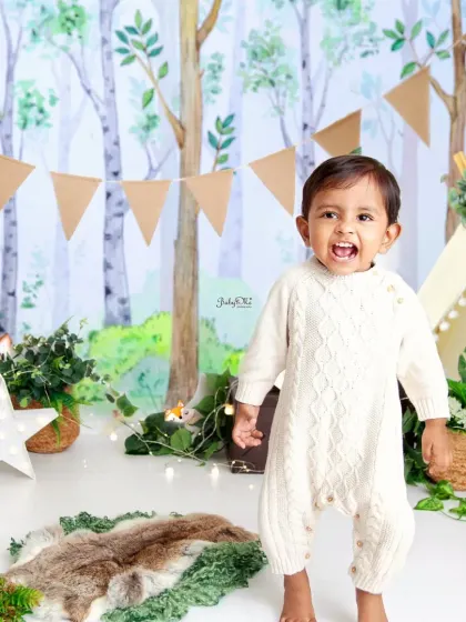 Celebrating a 'Wild One' first birthday. This woodland theme with its forest backdrop and rustic banner is perfect for a little king of all the wild things.