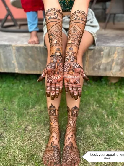 A complete bridal set with matching designs on the hands and feet, featuring palace and elephant motifs.