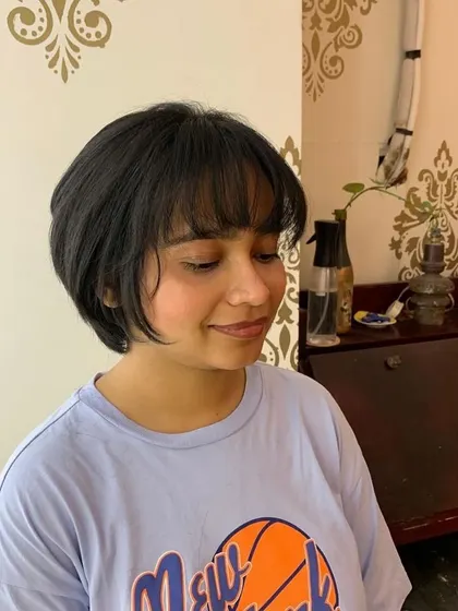 The wispy bangs give this bob a delicate, modern feel.