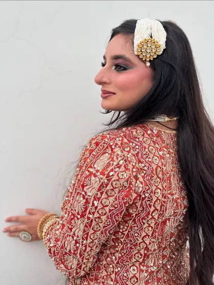 Another angle of this royal party look, highlighting the beautiful hair accessory and the smokey eye makeup.