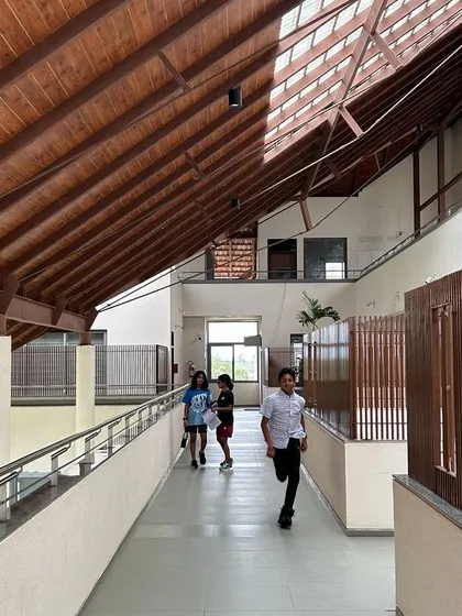 A duplicate image of students in a corridor at Vellore International School.