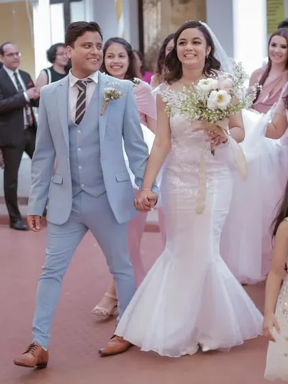 The grand exit from the church, with family and friends cheering on. We capture the joy and celebration of the moment.