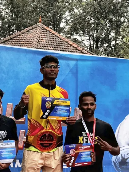 Standing tall on the podium with the championship belt. Our fighter Chandan after his victory at the Golden Mongkhon Muay Thai Nationals. We build champions through discipline and dedication.