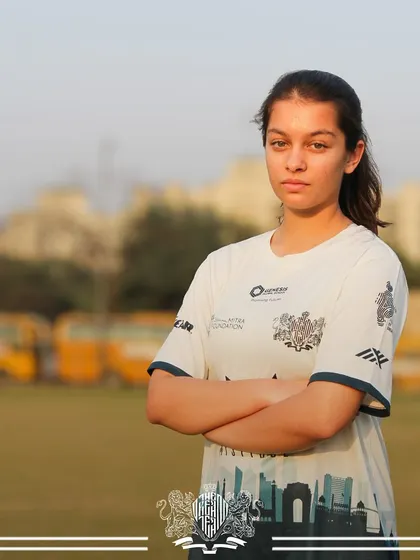 A portrait of a young, determined player from our women's team, representing the future of the club.