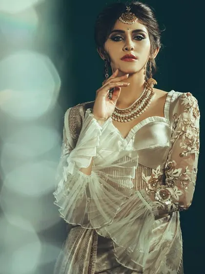 An artistic shot using lens flare and bokeh to create a dreamy, ethereal effect. This technique adds a layer of magic to the fashion portrait, making it feel less like a photo and more like a memory.