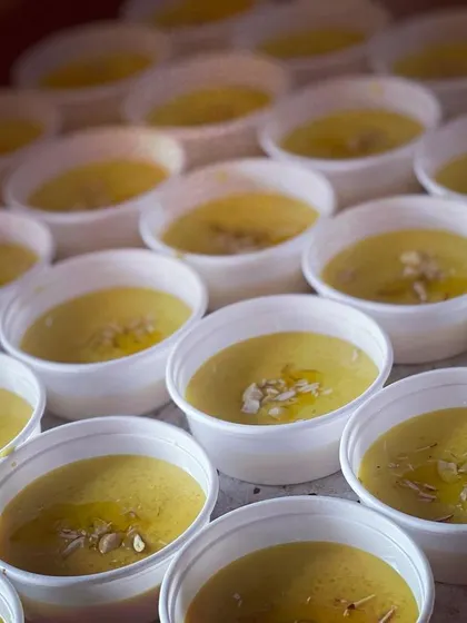 Individual cups of our classic Muzzafar sweet. This rich dessert is garnished with sliced almonds and a drizzle of ghee, making it a perfect end to a festive meal.
