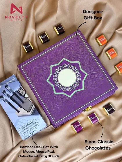 A festive hamper combining work and play. It features a bamboo desk set with a mouse pad and calendar, along with nine pieces of classic chocolates.