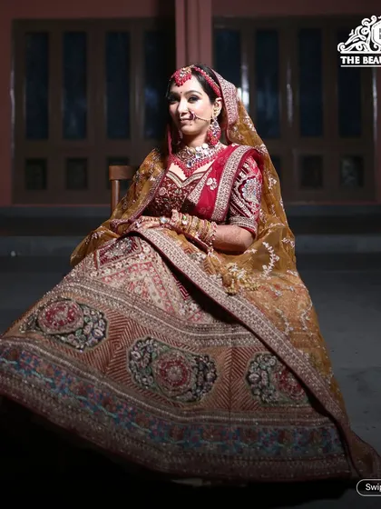 A full-length shot showcasing a magnificent bridal lehenga. My job is to create a makeup look that complements such a grand outfit perfectly.