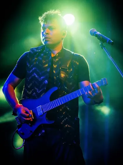Our electric guitarist, shredding a solo under the spotlight.