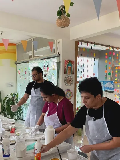 A group of participants getting their materials ready for the moon lamp workshop. I provide everything needed, from the base to the paints and textures.