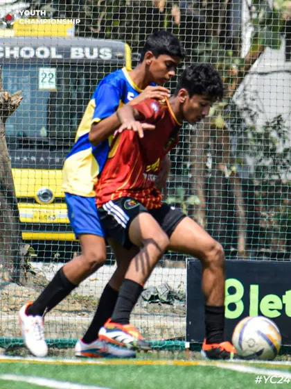 A physical battle for the ball, showcasing the strength and determination of our players.