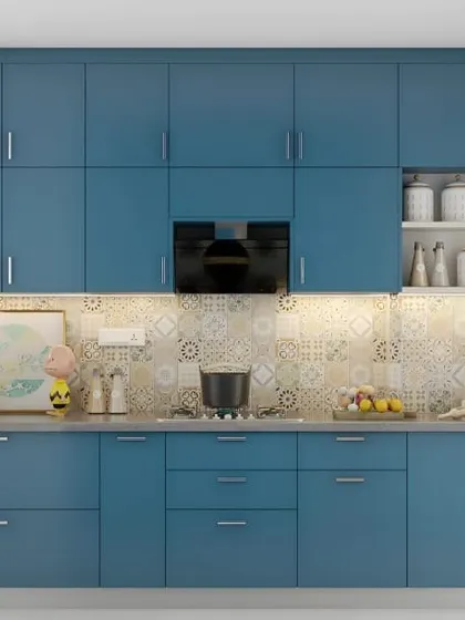 This is the same kitchen as a previous image, shown from a slightly different angle to highlight the expansive wall of blue cabinets. This view emphasizes the amount of storage achieved in this straight-wall layout.