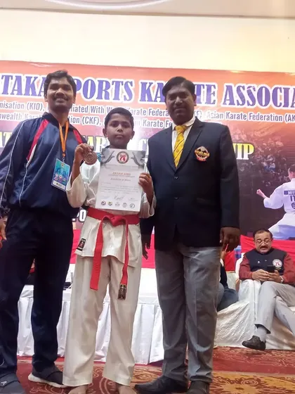 Posing with one of my young students who won a medal at the AKSKA State Level Championship.