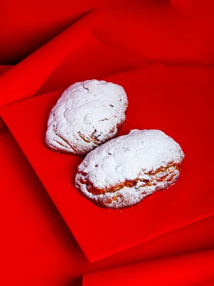 My Stollen loaves, generously coated in powdered sugar.
