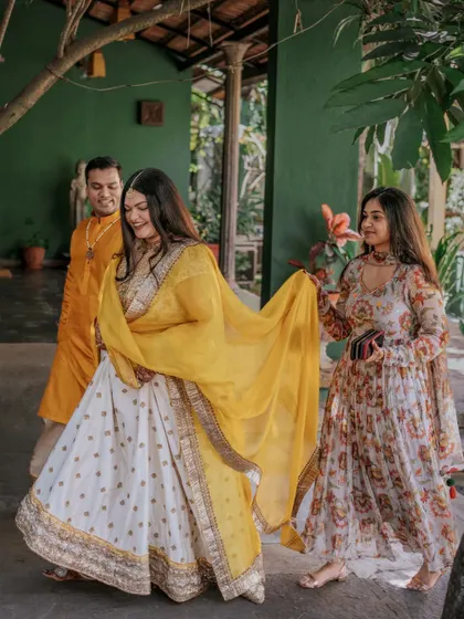 A portrait of the couple during their Haldi ceremony. Ridhi and Prashanth glittered in "yellove" amidst the greenery theme we tailored for them, using the venue's rustic charm as the perfect backdrop.