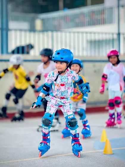 This young skater is all smiles as he glides across the rink. Our goal is to make learning to skate a fun and memorable experience for every child who joins our academy.