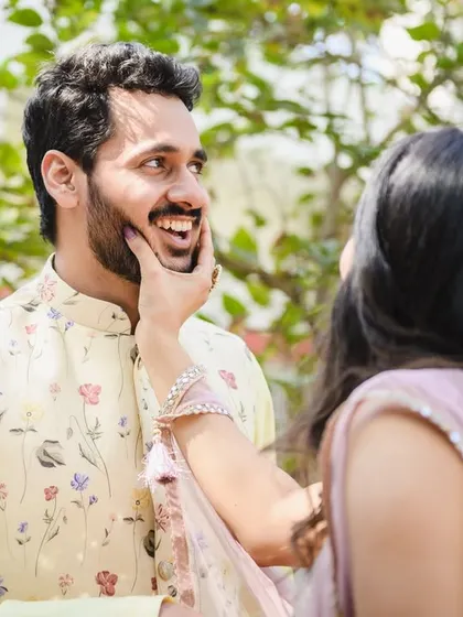 A sweet, candid moment from Srushti and Akshay's post engagement portrait session. Her playful touch and his happy smile say it all.