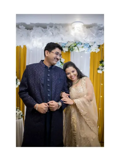 A sweet and simple portrait of the couple, her head resting on his shoulder, showcasing their comfortable and loving connection.