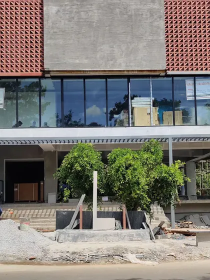 The building's facade is designed to be both functional and aesthetically pleasing, with the terracotta screen acting as a key architectural feature.