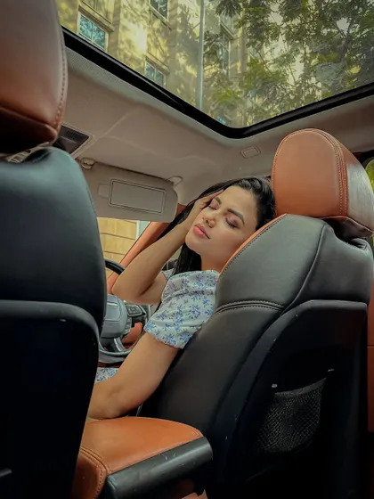 A relaxed, candid moment from the in-car shoot.