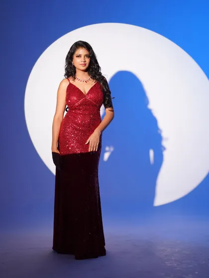 A beautiful red and maroon sequin gown, perfect for making a bold and glamorous statement at any party.