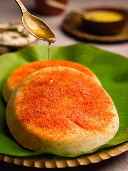 This is what a perfect breakfast looks like to me. I captured these cloud soft ghee podi idlis on a banana leaf, with a drizzle of warm ghee catching the light, to evoke that comforting feeling of a weekend morning at home.