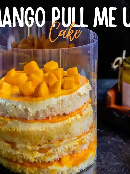 Get ready for some interactive fun with our Mango Pull Me Up Cake. Lift the plastic collar to watch a cascade of rich mango sauce flow over the layers of cake.