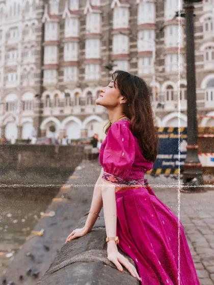 A beautiful portrait with the iconic Taj Mahal Palace hotel in the background. The vintage film effect adds a touch of nostalgia and romance to the image.