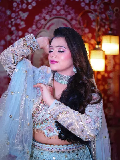 The delicate details on the blouse and the flowy dupatta of our sky-blue lehenga make it a truly special piece for any bride.
