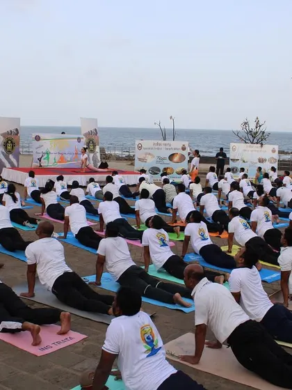 Students in Bhujangasana (Cobra Pose) by the sea. The energy of over 150 people practicing together with the ocean view was absolutely electric.