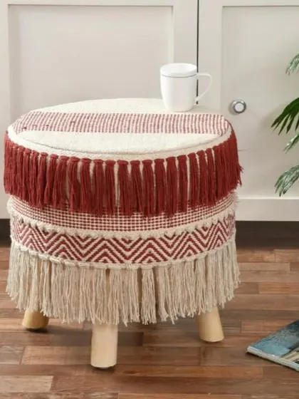 This red and beige layered fringe stool is full of texture and personality. It's a statement piece that brings warmth and style to your space.