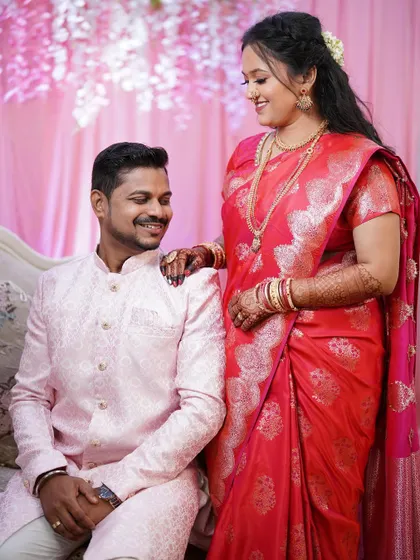 A sweet moment between the newly engaged couple. The bride's makeup is soft and romantic, perfect for these cherished photos.
