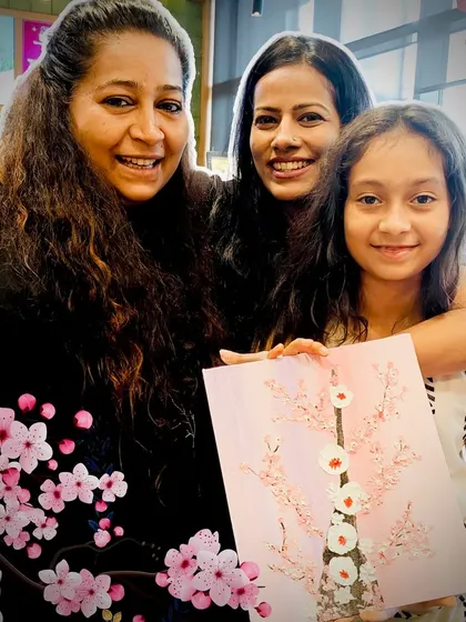 A beautiful moment of friendship and creativity, with a finished cherry blossom painting to remember the day.