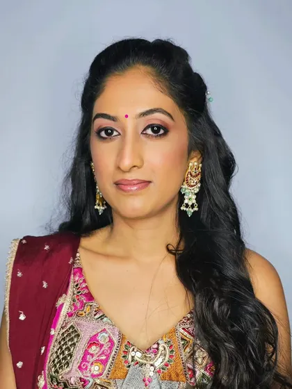 A close-up portrait of Sanjana's Mehendi makeup, highlighting the soft, natural finish.