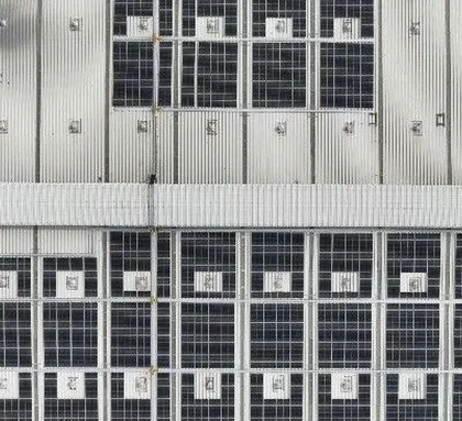 An overhead drone shot of the 640 KWp rooftop solar installation at the Velan Valves facility in Tamil Nadu. This view highlights the efficient use of roof space to maximize clean energy generation.