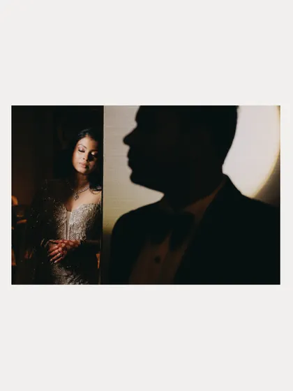 An artistic and moody portrait using shadows to create a sense of drama and intimacy.