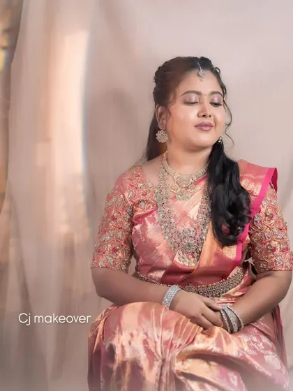 A beautiful portrait of a bride enjoying a quiet moment during her reception. Her makeup is soft and elegant, with a focus on her eyes.