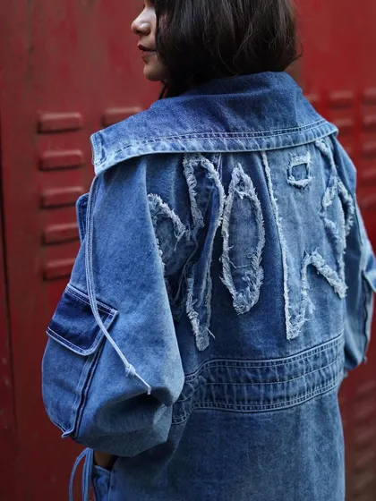 The details on the back are just as important. This shot shows the cool, distressed lettering on the back of the custom denim jacket.