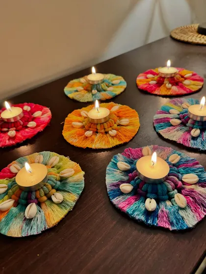 The full set of vibrant, lit tea light holders creates a beautiful and festive atmosphere.