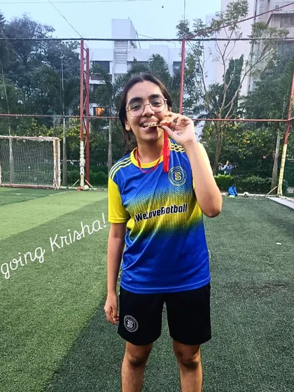 Krisha, a model of consistency and work rate, proudly displays her Player of the Month medal.