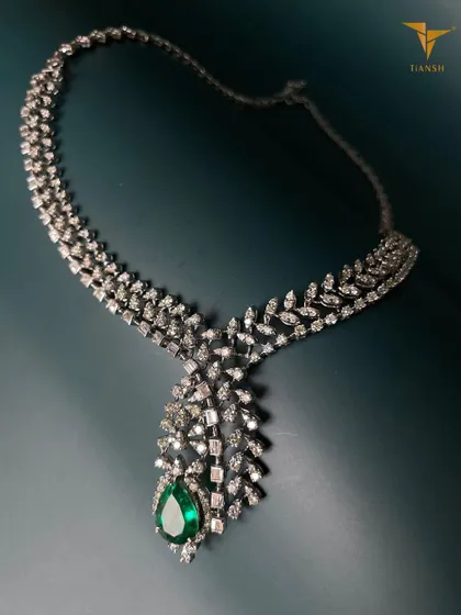 As you light up your home for the festivities, let your jewellery shine just as bright. This diamond and emerald necklace reflects tradition and elegance, just like you.