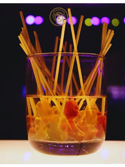 A glass full of sweetness. These gummy bear candy sticks are a fun and delicious way to garnish a drink or to just enjoy as a sweet treat at the bar.