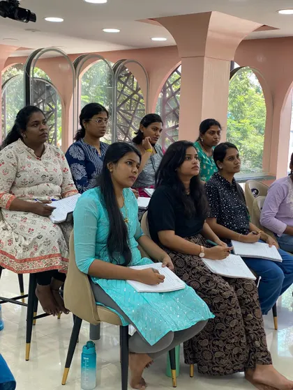 An attentive audience during a saree draping theory class. Before we start folding, we discuss different fabrics and draping styles.